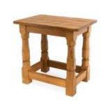 Workshop of Robert Mouseman Thompson (Kilburn): An English Oak Solid Top Stool, on four octagonal