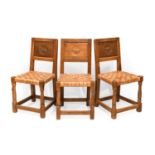 Robert Mouseman Thompson (1876-1955): Three English Oak Panel Back Chairs, circa 1930s, each