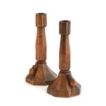 Robert Mouseman Thompson (1876-1955): A Pair of English Oak Candlesticks, of octagonal form with