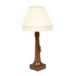 Robert Mouseman Thompson (1876-1955): An English Oak Table Lamp, octagonal column on a square