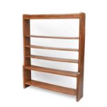 Robert Mouseman Thompson (1876-1955): An English Oak Open Backed Bookcase, dual depth ends, with a