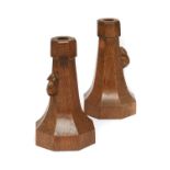 Robert Mouseman Thompson (1876-1955): A Pair of English Oak Candlesticks, circa 1930s/40s, of