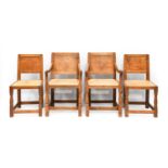 Robert Mouseman Thompson (1876-1955): A Set of Four (2+2) English Oak Panel Back Dining Chairs,