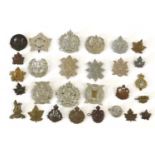 A Collection of Twenty Eight Canadian Cap, Collar and Glengarry Badges, including three First