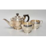 A Three-Piece Silver Tea-Service, by William Neale and Son Ltd., Birmingham, 1934, in the Art Deco-