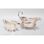 A George VI Silver Sauceboat, Birmingham, 1939, in the George III style, oval and on three pad feet,