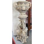 A Late Victorian Jardiniere on Stand, decorated with dolphins, overall 121cm