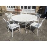 A White Painted Cast Metal Circular Garden Table of Lattice Design, together with 5 matching chairs,