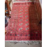 Afghan Rug, the crimson field of guls enclosed by multiple borders, 197cm by 122cm, together with