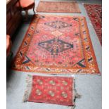 A Baluch Prayer Rug, the field with two Mihrabs enclosed by multiple borders, 127cm by 92cm; with