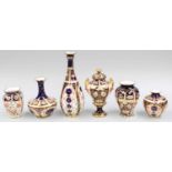 A Royal Crown Derby Vase and Cover and four various Royal Crown Derby vases