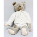 An Early 20th Century Large Teddy Bear, with black stitched claws, cotton pads, stitched nose,