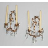 A Pair of Gilt Metal Twin Light Wall Sconces, or foliate form and with lustre drops, 40cm