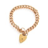 A Curb Link Bracelet, end link stamped '15', with a 9 carat gold heart shaped padlock clasp,