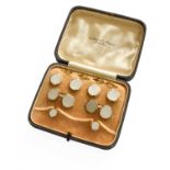 A Mother-of-Pearl Dress Stud and Cufflink Suite, comprising of four buttons, two studs and a pair of