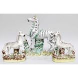 Staffordshire Zebra, and a smaller pair (3)Each with chipped ears, one with heavy wear to the