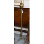 An Art Nouveau Brass Oil Lamp and Stand, with hinks burner, 155cm high