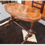 A 19th Century Inlaid Walnut Table, oval top on turned and carved supports, 107cm by 60cm by