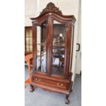 A Reproduction French Carved Mahogany Display Cabinet, with scrolling leaf and shell surmount on