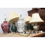 Five Various Oriental Style Porcelain Table Lamps, two with a green glaze; together with a pair of