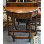 A 20th Century Carved Oak Demi Lune Hall Table, on barley twist supports, 77cm by 37cm by 85cm