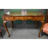 A Reproduction Mahogany Leather Inset Writing Table, fitted with three drawers, 111cm by 55cm by