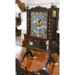 A Victorian Carved Mahogany Firescreen, with barley twist supports and beadwork panel, 60cm by