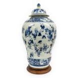 A Chinese Porcelain Alcove Vase and Cover, in Kangxi style, of baluster form, painted in