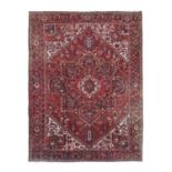 Heriz CarpetNorth West Iran, circa 1930The blood red field of angular vines around a large cruciform