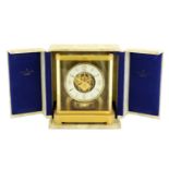 A Brass Atmos Clock, signed Jaeger LeCoultre, 20th Century, case with five glass panels, stop/