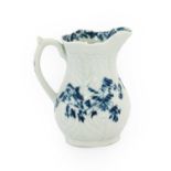 A Worcester Porcelain Cream Jug, circa 1756, painted in underglaze blue with the Feather Mould