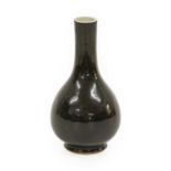 A Chinese Black-Glazed Porcelain Vase, Qing Dynasty, of pear form15cm highRestored. The body over