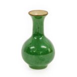 A Chinese Green-Glazed Porcelain Vase, Qing Dynasty, of ovoid form, the trumpet neck with brown