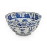 A Chinese Porcelain Bowl, Wanli, of fluted circular form, painted in underglaze blue with a