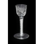 A Scottish Jacobite Wine Glass, circa 1750, the ogee bowl engraved with rose buds and a thistle,