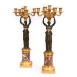 ~ A Pair of Gilt and Patinated Bronze Seven-Light Figural Candelabra, 19th century, in the manner of