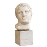 After the Antique: A White Marble Bust of a Roman Emperor, probably 18th century32cm high, on a