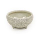 A Chinese Crackle Glaze Porcelain Censer, Qing Dynasty, of circular form with three lug feet12.5cm