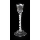 A Deceptive Cordial Glass, dated 1764, the semi-fluted rounded funnel bowl on air twist stem and