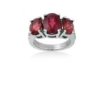 A Pink Tourmaline and Diamond Ringthree graduated pink tourmalines in white claw settings, flanked
