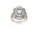 An 18 Carat White Gold Diamond Cluster Ringthe central round brilliant cut diamond within a border