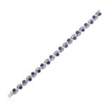 A Sapphire and Diamond Bracelettwenty oval cut sapphires surmounted by alternating side demi-lune