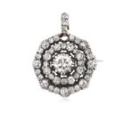 A Diamond Brooch/Pendant the central old cut diamond within a double spaced border of smaller old