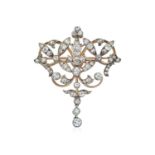 A Victorian Diamond Brooch/Pendantof openwork scroll form, set throughout with old cut and rose