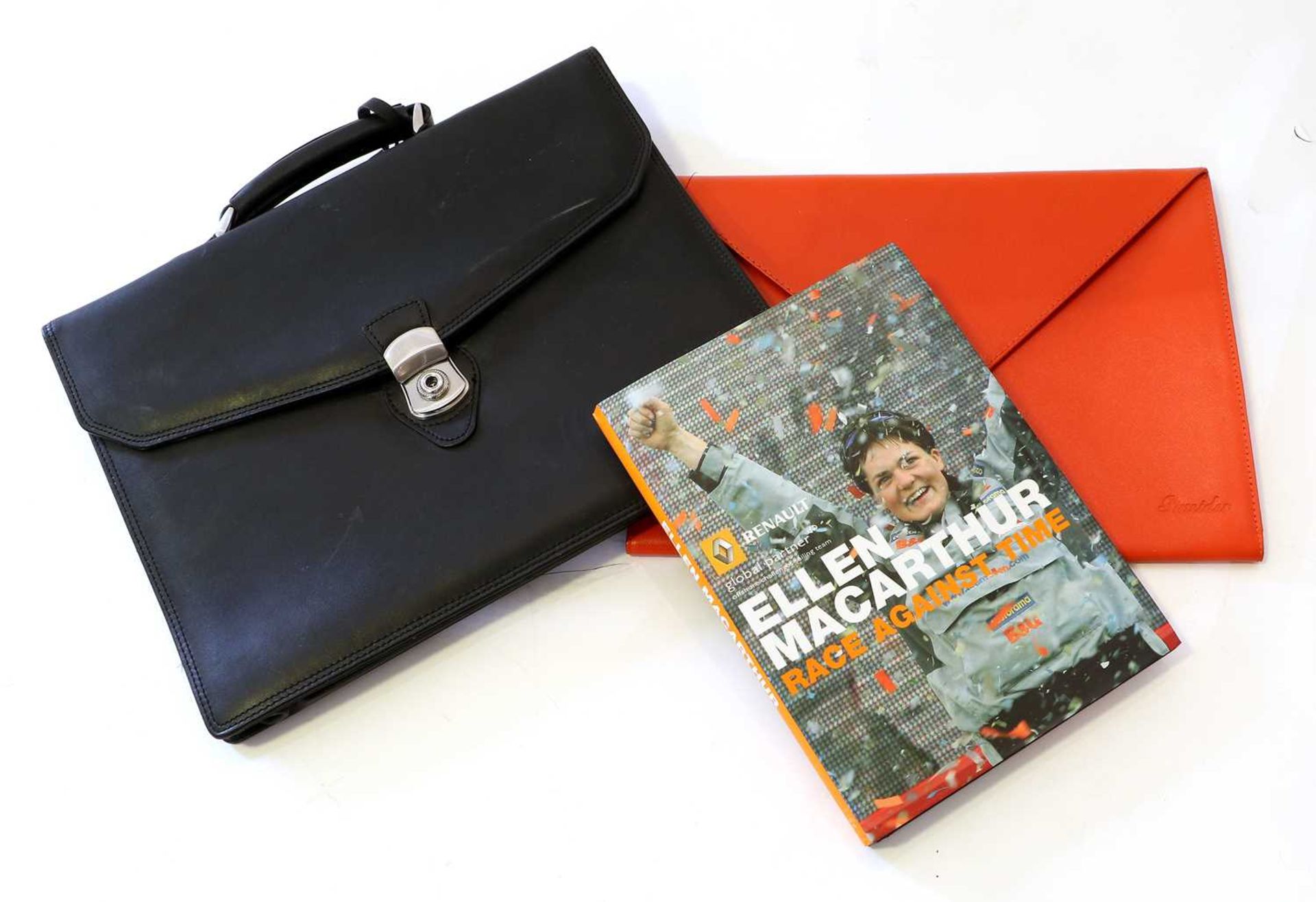 A Jaguar Black Leather Briefcase, A Fiat Stilo Red Leather Folder by Pineidder and a Signed Hardback