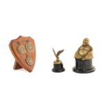 A Brass Car Accessory Mascot, in the form of a winged eagle7cm highThree EA and DMCC Club Medals,