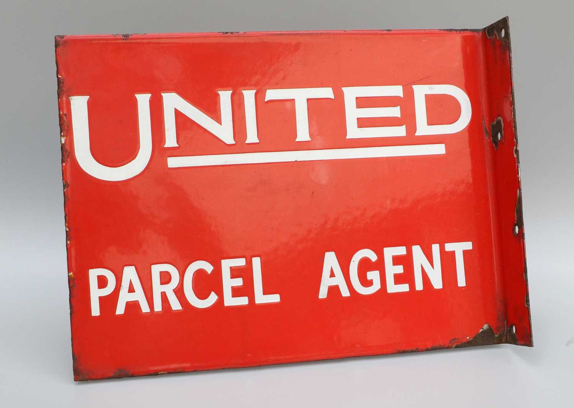 An Original Red Enamelled Double-Sided Advertising Sign: UNITED PARCEL AGENT23cm by 31cm