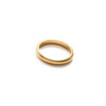 A 22 Carat Gold Band Ring, finger size LMaker’s mark rubbed, Chester, 1941. Gross weight 4.2 grams.