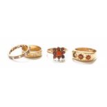 Two 9 Carat Gold Garnet Rings (one with a stone lacking); A 9 Carat Gold Paste Eternity Ring (a.f.);