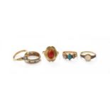An 18 Carat Gold Diamond Solitaire Ring, finger size N; A Coral Ring, stamped '585', finger size